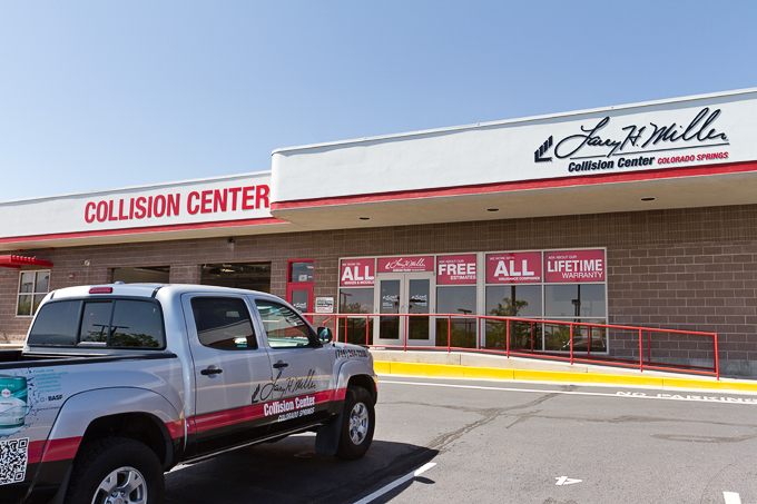 Outdoor signage at Larry H. Miller Collision Center in Colorado Springs, CO.