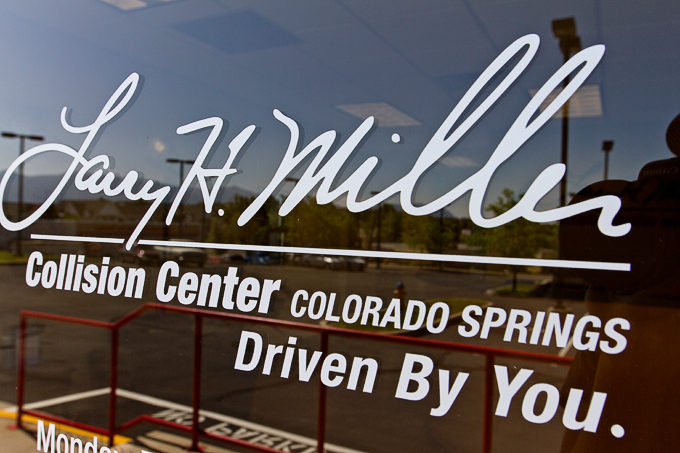 Outdoor signage at Larry H. Miller Collision Center in Colorado Springs, CO.